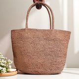 Raffia straw tote bag bottom view – handwoven natural fibre beach bag structured reinforced base
