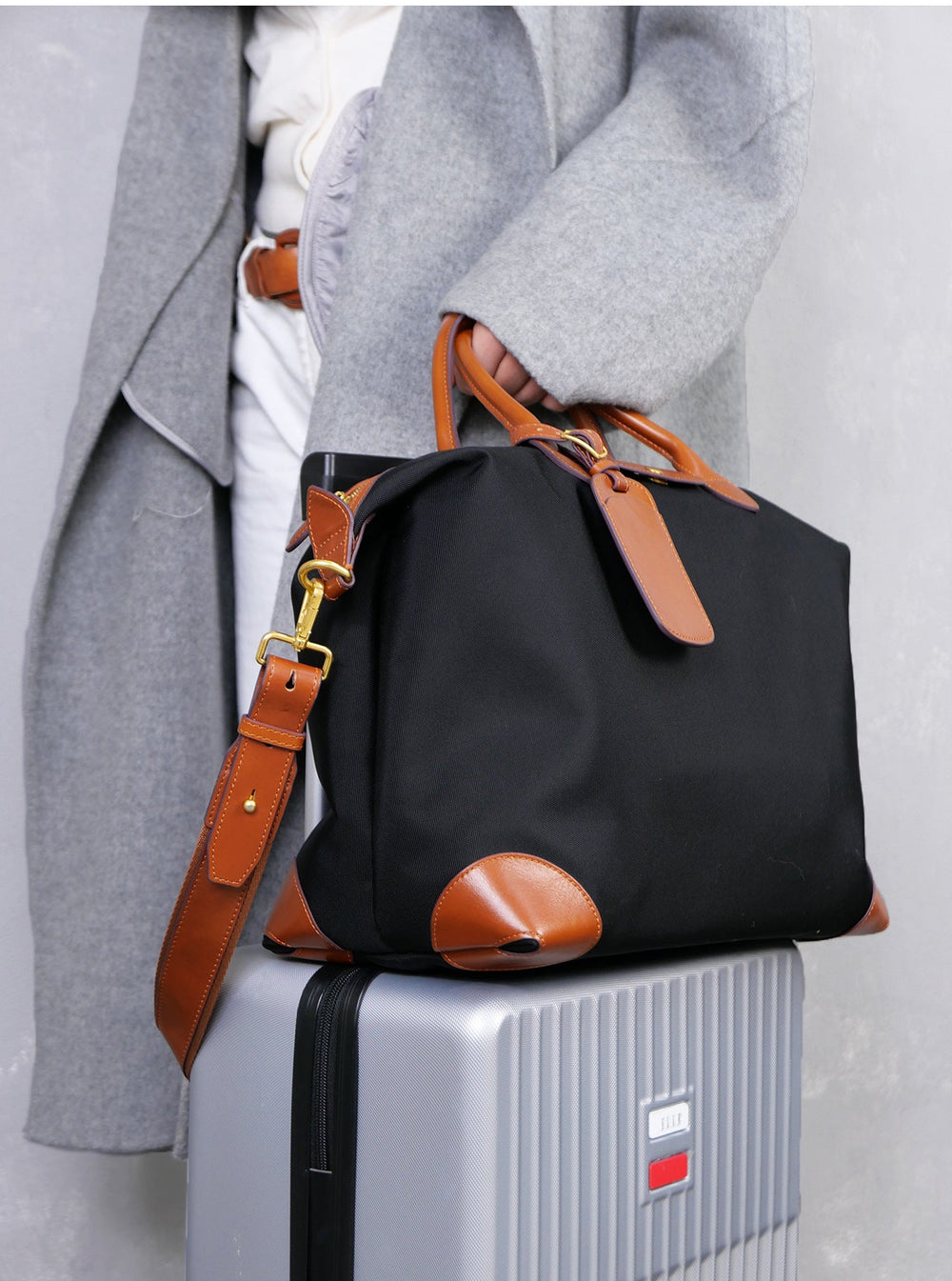 Recycled nylon cowhide tote detail shot – nylon body texture and cowhide leather strap join