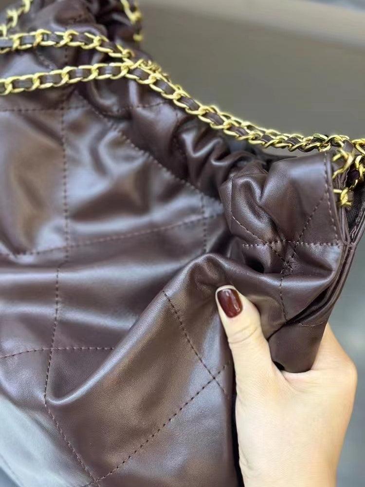 Brown quilted leather shoulder bag with gold chain strap, minimalist elegant design