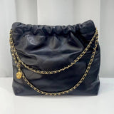 Black calfskin leather shoulder bag with gold tone chain and quilted minimalist design