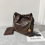 Dark brown calfskin leather shoulder bag with gold-tone chain on a marble table