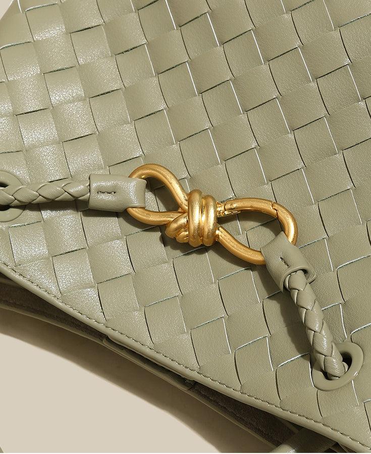 Woven cowhide leather shoulder bag in sage green with gold knotted metal buckle detail