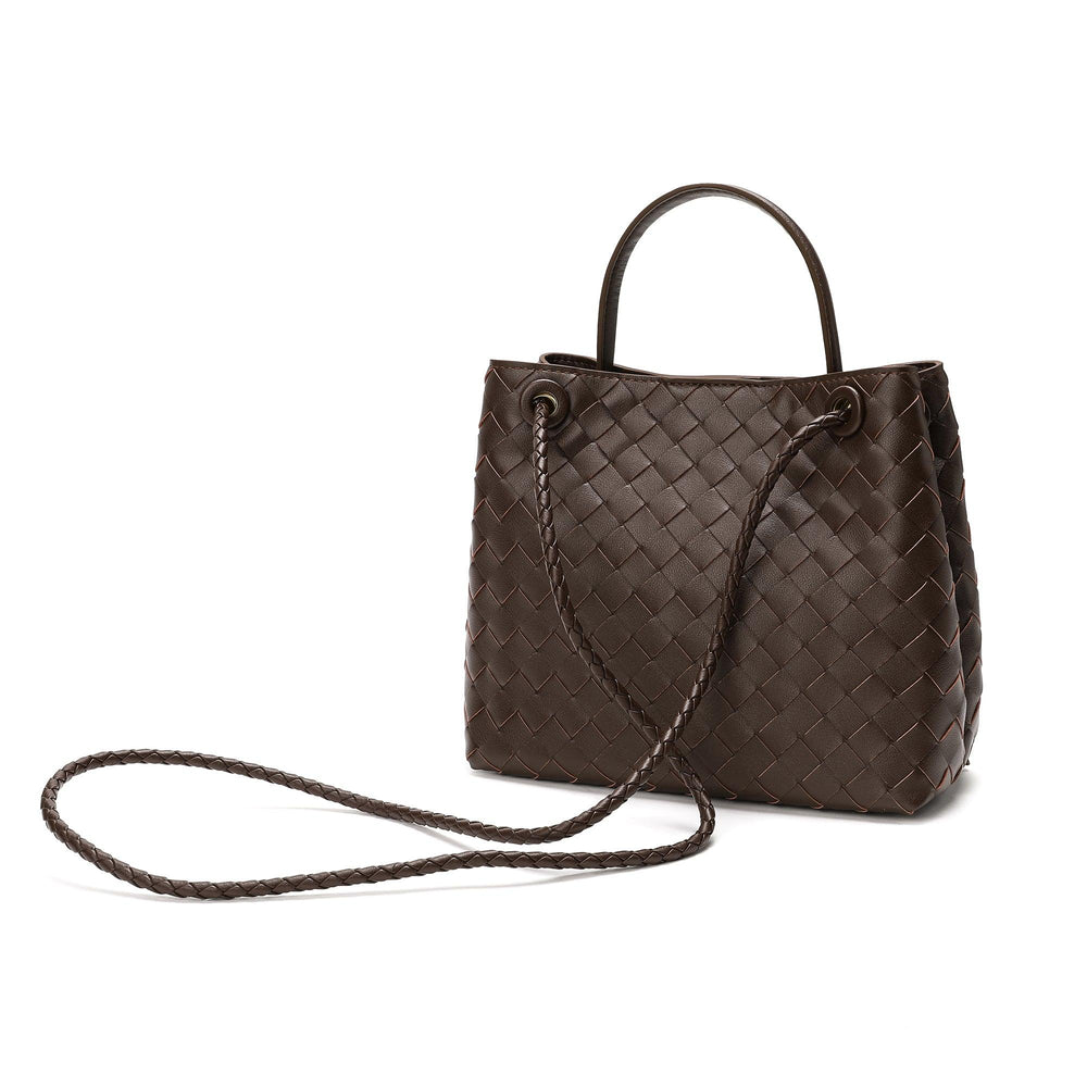 Dark brown woven leather shoulder bag with braided strap and metal eyelets on white background