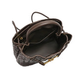 Open brown cowhide leather woven shoulder bag with gold metal buckle and spacious interior