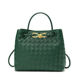 Green woven leather shoulder bag with gold metal buckle and top handle