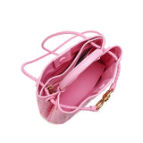 Pink woven leather shoulder bag with braided handles, gold metal buckle, and spacious interior