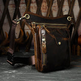Full grain dark brown leather leg bag with zipper pockets and metal rivet details
