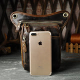 Full grain dark brown leather leg bag with zipper pockets and metal rivet details