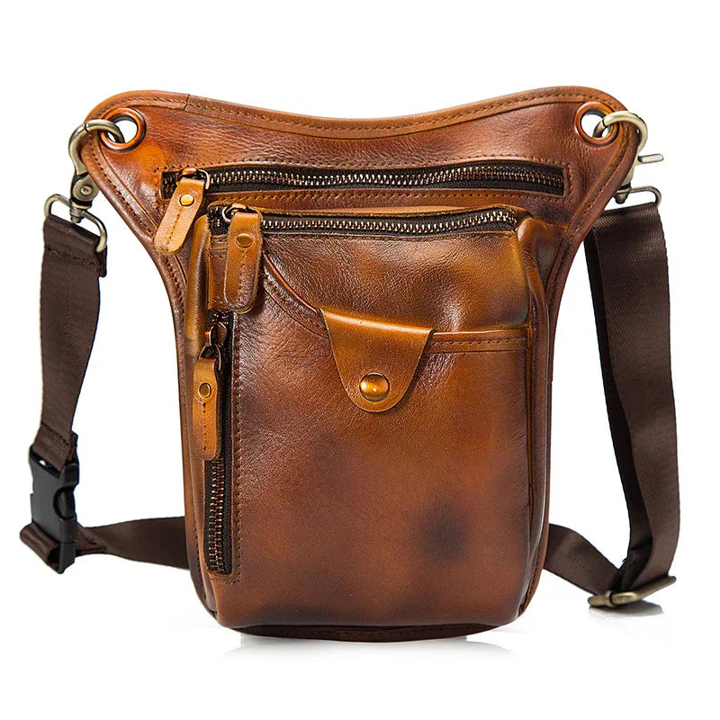 Brown full grain leather leg bag with multiple zippered pockets and adjustable strap