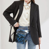 Full grain leather blue leg bag with zippered pockets and adjustable straps