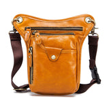 Full grain leather leg bag with brown straps, multiple zip pockets, and gold hardware.