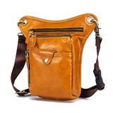 Full grain leather leg bag with multiple zip pockets and adjustable brown strap