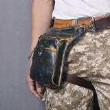 Full grain leather leg bag with multi-zip pockets worn on waist, camouflage pants visible