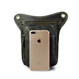 Full grain leather leg bag with zippered pockets and brass snap closures, motorcycle waist pouch dark grey