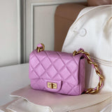 Pink quilted leather shoulder bag with gold chain strap and flap lock on a white surface.
