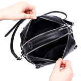Top view of a black genuine leather handbag with dual zipper compartments and a shoulder strap