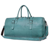 Teal full grain leather duffle bag with handles and adjustable shoulder strap for travel