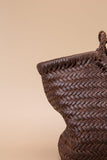 Handcrafted woven brown leather tote bag with hobo shape and braided detailing