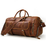Handmade full grain leather duffle bag with front pocket, shoulder strap, and shoe compartment