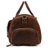 Handmade full grain leather duffle bag in dark brown with front zipper pocket and double handles