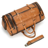Handmade full grain leather duffle bag in dark brown with buckles and shoe compartment