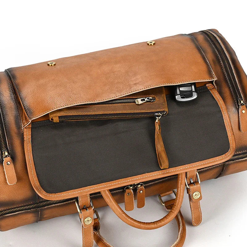 Handmade full grain leather duffle bag in brown with shoe compartment and organized pockets
