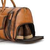 Handmade full grain leather duffle bag with shoe compartment and zipper, in dark brown.