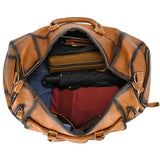 Open full grain leather duffle bag packed with clothes and accessories, travel bag