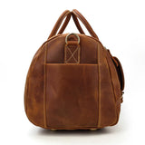 Side view of handmade full grain leather duffle bag in dark brown with sturdy handles