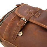 Handmade full grain brown leather duffle bag with buckle detail and contrast stitching