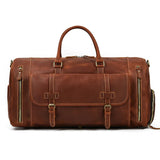 Handmade full grain leather duffle bag with shoe compartment and front buckles, dark brown.