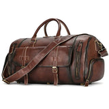 Dark brown handmade full grain leather duffle bag with shoulder strap and front pockets