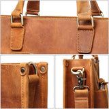Close-up of handmade full grain leather messenger bag with sturdy stitching and metal hardware.