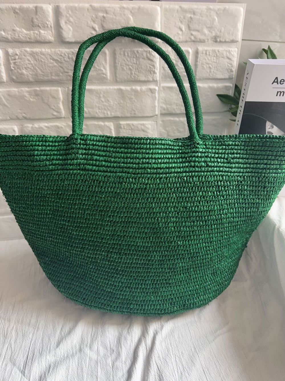 Natural raffia tote open top view – spacious handwoven straw beach bag interior