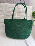 Handwoven raffia tote bag weave close-up – natural raffia grass texture detail artisan made