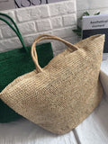 Raffia straw tote bag handle detail – reinforced woven handle on natural handmade beach tote