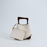 IT Ozzy Bag | Modern Chic Leather Shoulder Bucket Bag with Amber Acrylic Handles