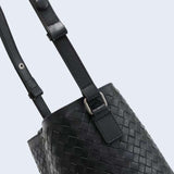 Black woven lambskin leather bucket bag with adjustable strap and silver-tone hardware