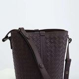 Dark brown woven lambskin leather bucket bag with adjustable shoulder strap