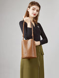 Woman posing with brown woven lambskin leather bucket bag, small shoulder crossbody purse