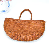 Handwoven full grain leather ladies handbag in brown, bamboo style basket design