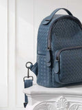 Blue handwoven lambskin leather backpack with quilted texture and front zipper pocket