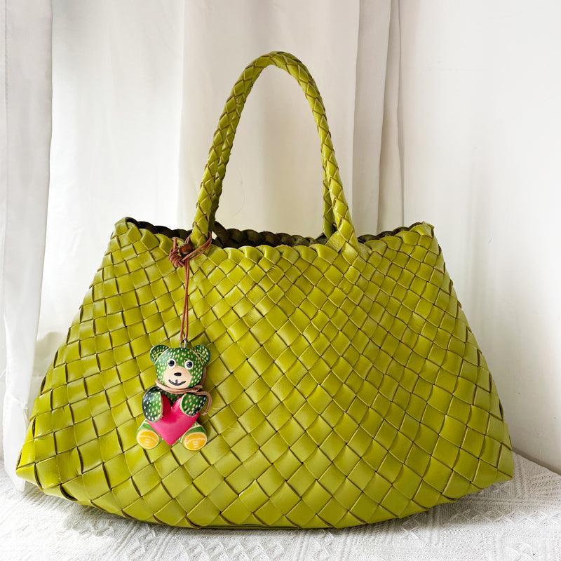 Two olive green woven leather hobo shoulder bags with long handles