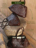 Handcrafted Italian cowhide leather woven bags with coffee color, short and long handles on rustic floor.