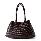 Dark brown woven leather hobo bag with long handles, trapezoidal shape, on white background