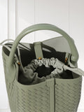 Sage green handwoven lambskin leather bucket bag with drawstring pouch and gold hardware