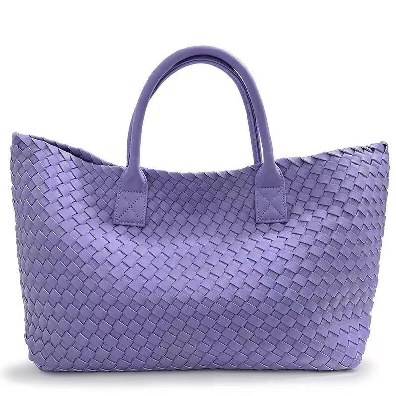 Large woven vegan leather tote bag in lavender with dual handles, fashion accessory