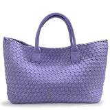 Large woven vegan leather tote bag in lavender with dual handles, fashion accessory