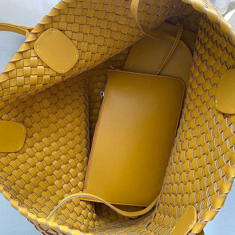 Interior of large yellow handwoven vegan leather tote bag with matching pouch