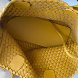 Interior of large handwoven yellow vegan leather tote bag with spacious lining
